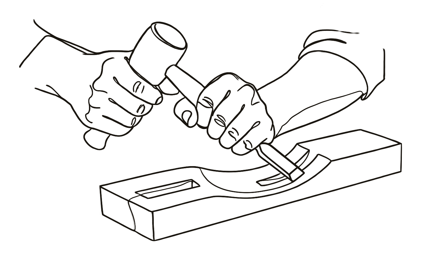 Hands at work with mallet and chisel